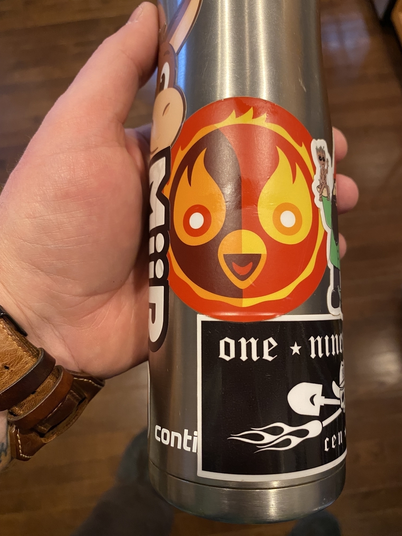 Picture of an aluminum water bottle decorated with stickers.